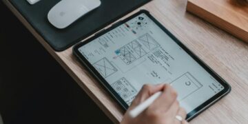 person writing on white paper