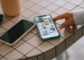 Two smartphones on a tiled surface