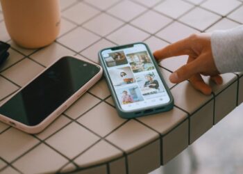 Two smartphones on a tiled surface