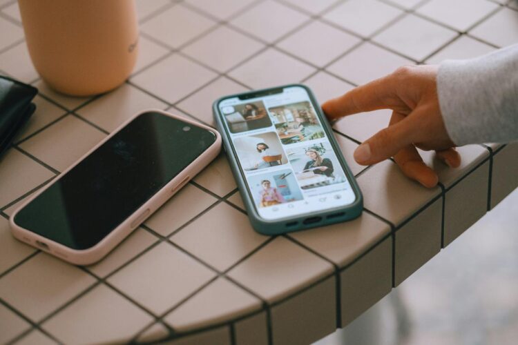 Two smartphones on a tiled surface