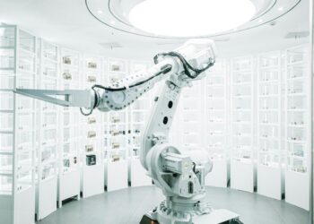 white robotic arm in display showroom