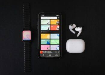 black iphone 4 with red and black watch