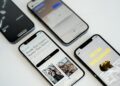three different cell phones sitting next to each other