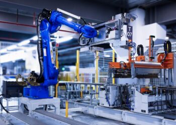 blue industrial robot arm in factory
