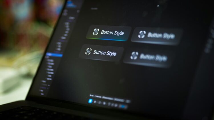 Laptop screen displays four button style options